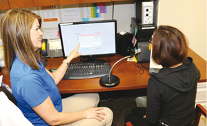 Therapist Kathleen Thoede, MC, CCC-SLP works with a patient using the BIG and LOUD therapy program.