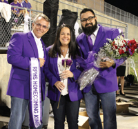 Ron Ewer, Jennifer Leonetti and Omar Mata at Ridge Point High School’s 2015 homecoming game. Each year, the purple jacket members gather on the field to crown the homecoming royalty, a tradition that began with Ewer in 2012.