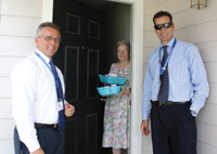 Ron Ewer and Patrick Sexton delivering meals to  a client of Fort Bend Seniors Meals on Wheels.