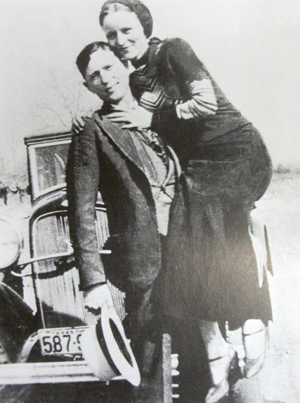 Clyde Barrow and Bonnie Parker before the law caught up with them.  Photo from History of the World in Photographs.