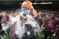 Head Coach Ricky Tullos received the traditional water dousing from players Ryan Moore, Austin Price and Toby Ndukwe.