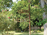 The sign post at New Home Cemetery.