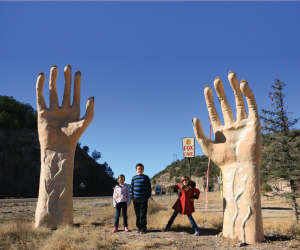 Lauren, Caden and Siena Hill at one of the massive pop culture structures outside of Fox Cave in Ruidoso Downs, New Mexico.