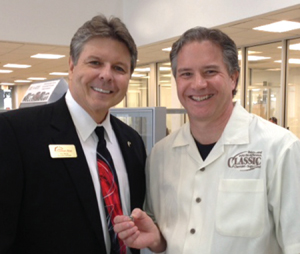 Fulshear Area Chamber of Commerce Director Don McCoy presents Don Kerstetter with a membership pin. 